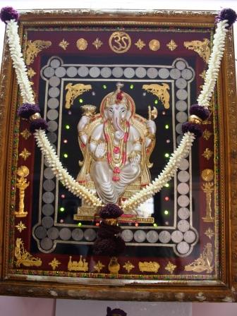 Ganesha, framed in 50 paisa coins